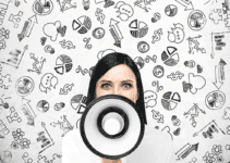 Employee Engagement Woman with Loudspeaker in Front of Face and Various Business Icons Floating Behind