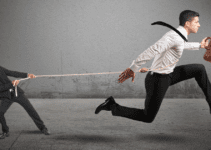 Boss Trying to Hold Employee with Lasso While Employee is Running Away