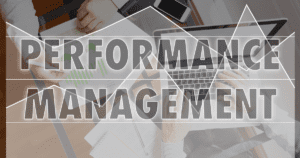 Performance Management Transparent Graph Layered on Top of Person Working on Computer at Desk