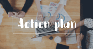 Action Plan Written in Fun Font Over Background of People's Arms Working Together at Large Table