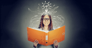 Smiling Woman With Glasses Reading Book with Abstract Lines Extending to Her from the Book and Line Art Light Bulb Above Her Head