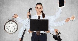 Multitasking Businesswoman with Multiple Arms all Holding Various Business Items